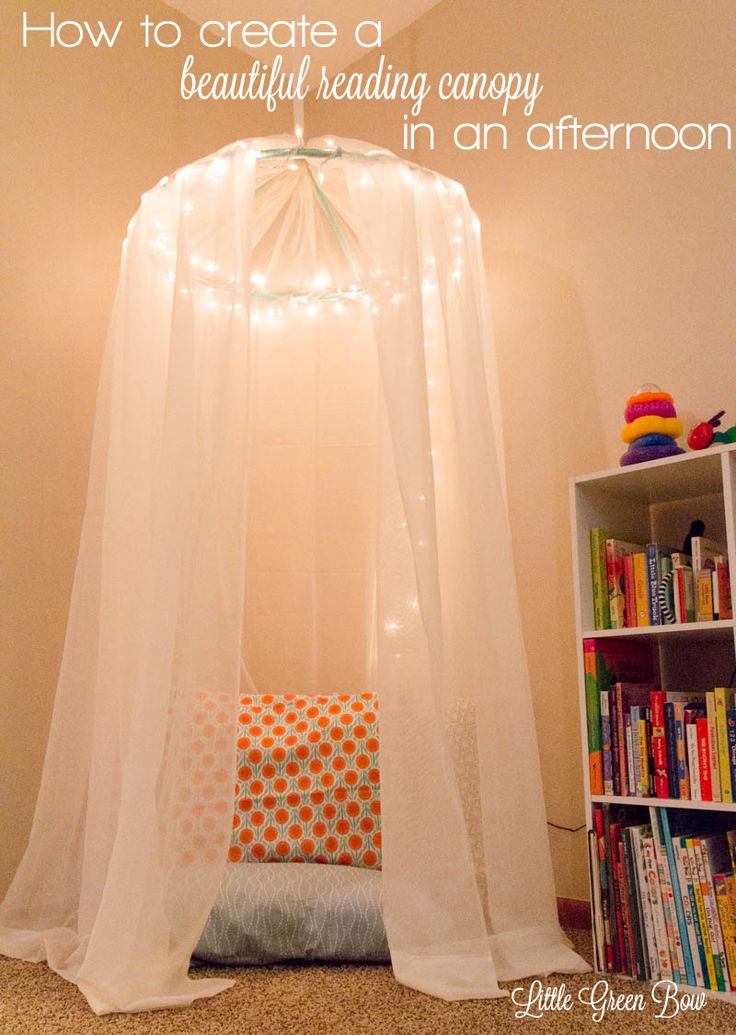 a canopy bed with lights hanging from it's sides and the words how to create a beautiful reading canopy in an afternoon