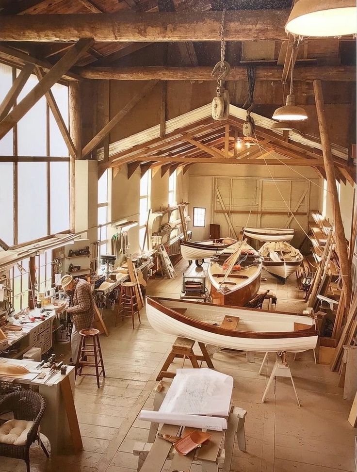 an old boat is being worked on in a woodworking shop with lots of tools