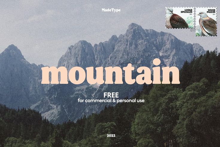 there is a mountain with trees and mountains in the background that says mountain free for commercial & personal use