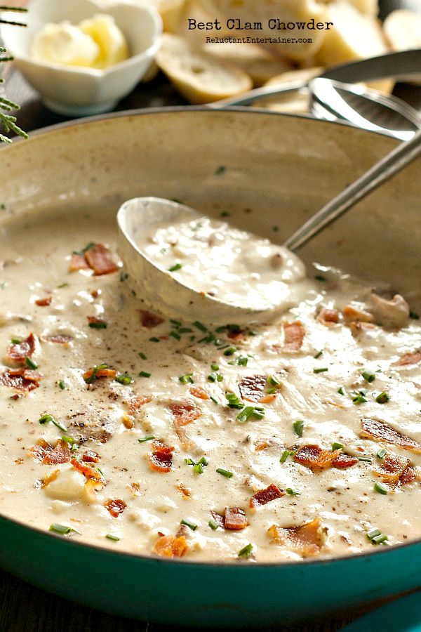 a green pot filled with white sauce and bacon