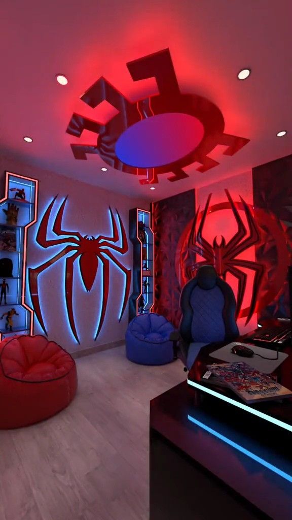 a living room decorated in red and blue with spider - man decorations on the ceiling