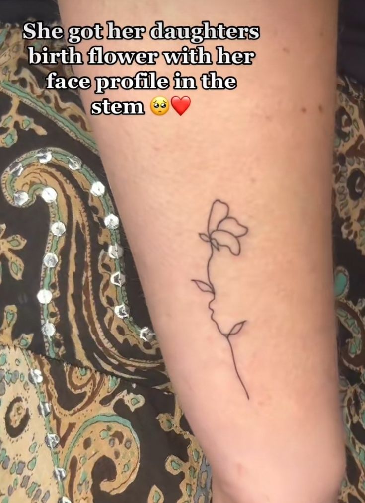 a woman's foot with a tattoo on it that says, she got her daughters birth