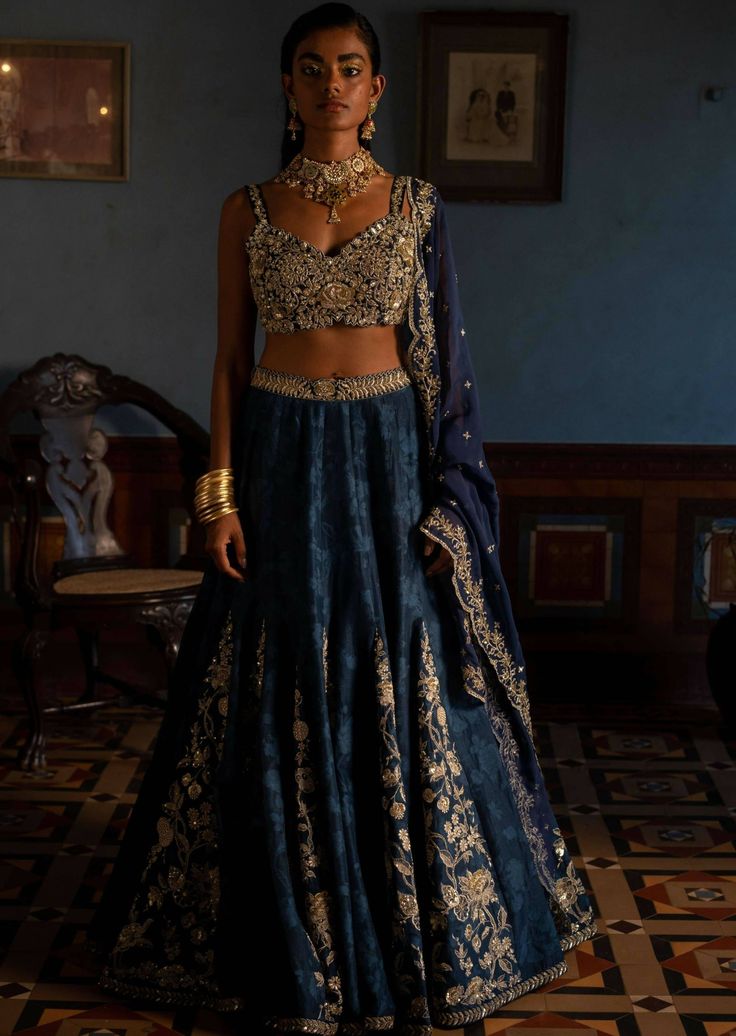 Featuring the navy blue self woven Russian jacquard kali lehenga set paired with heavily jaal hand embroidered blouse and antique gold tone work in addition with organza base dupatta. Kali Lehenga, Navy Blue Lehenga, Hand Embroidered Blouse, Blouse Yoke, 1950’s Fashion, Organza Lehenga, Navy Blue Print, Tunic Designs, Blue Lehenga