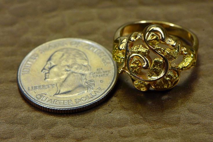 "Gold Nugget Ring \"Orocal\" RL462 Genuine Hand Crafted Jewelry - One of a Kind - 14k Yellow Gold Casting - Total weight = 7.35G \" If this is not in Stock our Jeweler will make it in 4-6 weeks\" Specs and Dimensions: Length/Width Nugget Size - - 7 R stands for Ring L for Ladies, M Stands for Men and Q stands for the Quartz / E Stands for Earrings, and P stands for Pendants. Diamonds are G color High Quality Diamonds. With This Stunning Gold Nugget Ring you will receive a certificate of authenti Gold Nugget Ring, Natural Gold Nugget, Wrightsville Beach Nc, Wrightsville Beach, Gold Nugget, Ladies Ring, Gold Alloys, Natural Gold, Hand Crafted Jewelry