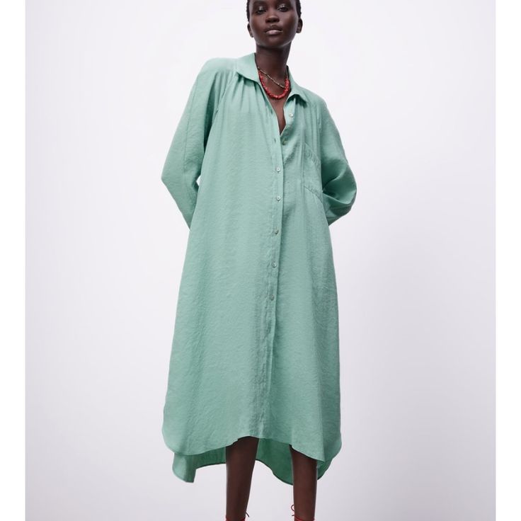 Full Cut Flowy Dress With Lapel Collar And V-Neckline With Below-The-Elbow Length Cuffed Sleeves. Front Patch Pocket. Asymmetric Hem With Side Vents. Front Button Closure. M: Armpit To Armpit 21”, Length 48” L: Armpit To Armpit 22”, Length 48” Color Sea Green V-neck Viscose Shirt Dress For Summer, Zara V-neck Shirt Dress For Daywear, Green V-neck Shirt Dress For Day Out, Viscose V-neck Shirt Dress For Summer, V-neck Viscose Shirt Dress For Spring, Green Tunic Dress For Daywear, Green V-neck Shirt Dress, Casual Green High-low Hem Dress, Asymmetrical Hem Shirt Dress For Summer Daywear