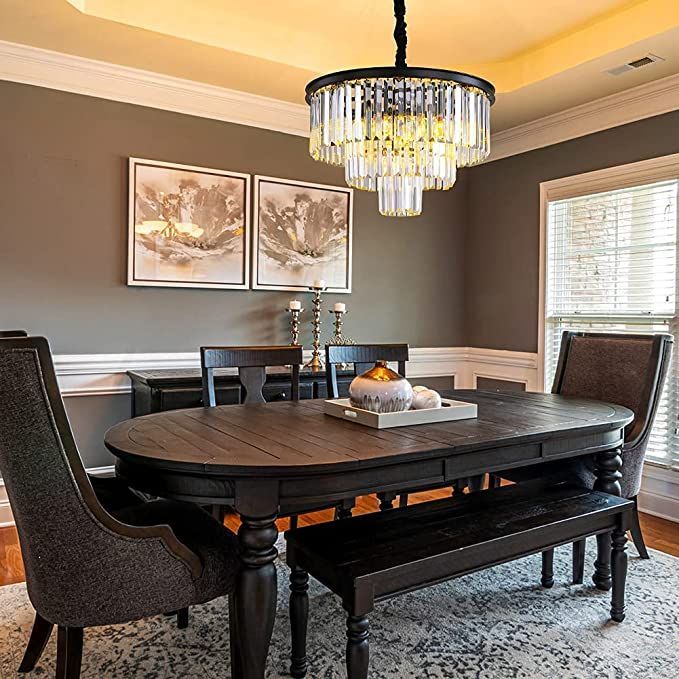 a dinning room table with chairs and a chandelier