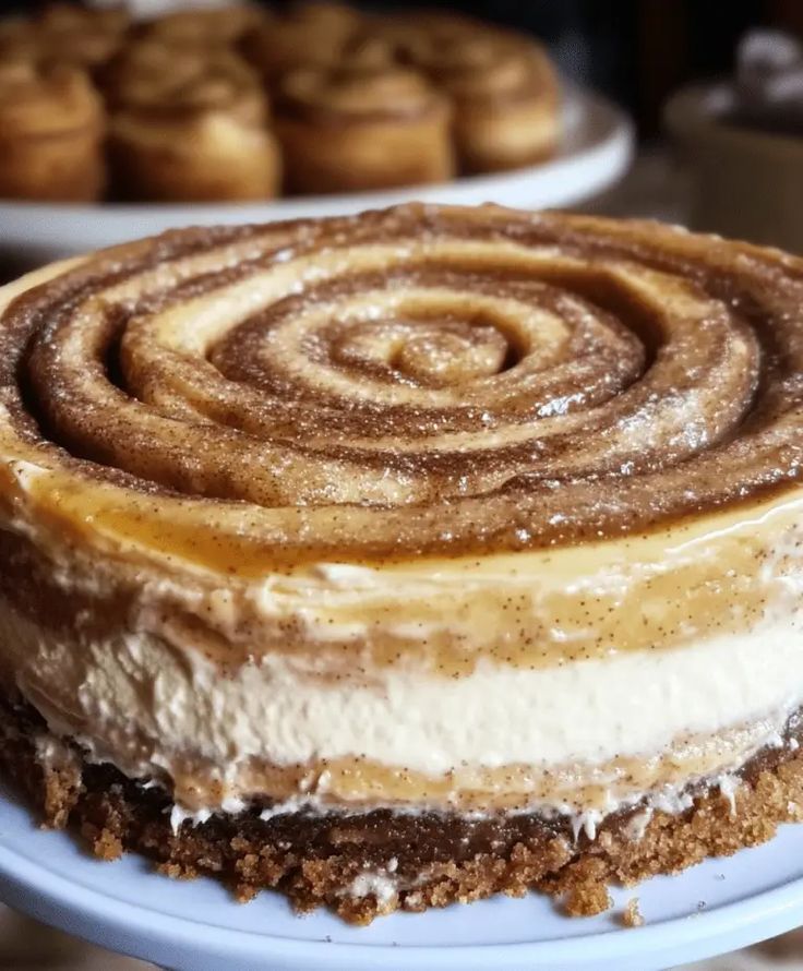 a close up of a cake on a plate with other pastries in the background