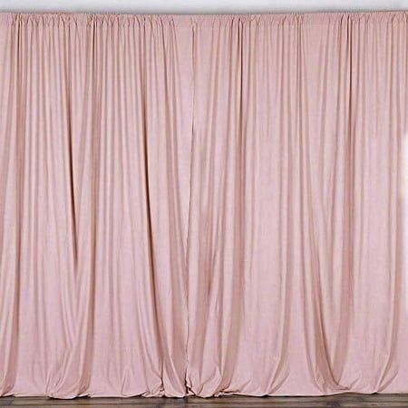 a pink curtain is hanging in front of a white wall