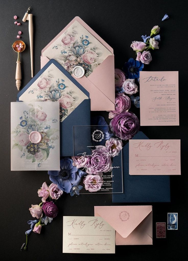 the wedding stationery is laid out on top of each other, with different colors and designs