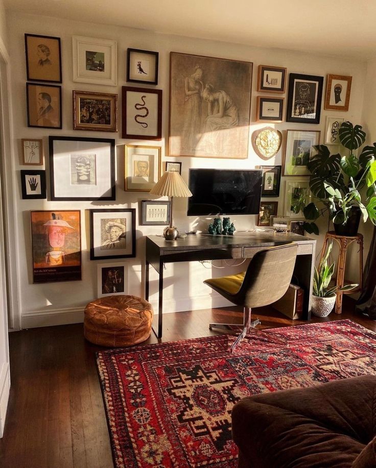 a living room filled with furniture and pictures on the wall next to a rug covered floor