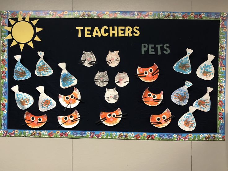 a bulletin board with cats and fish on it that says teachers pets in front of a sun