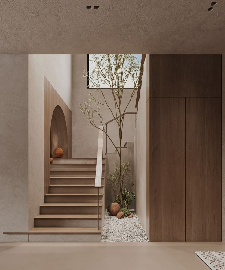 the interior of a modern house with wood stairs