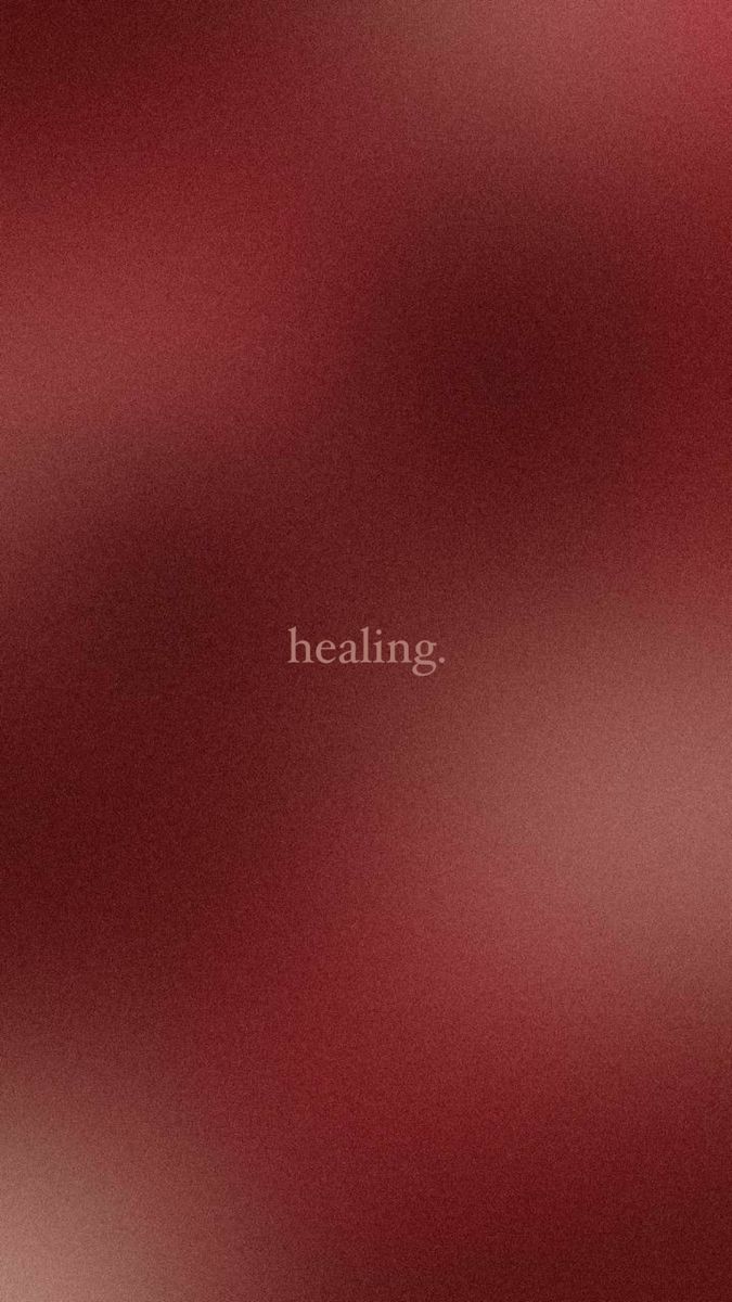 blurry image with the words'healing'written in white on red background