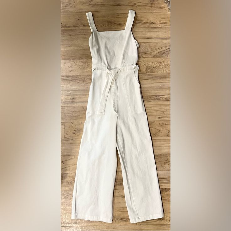 Nwt White Denim Jumpsuit From Cooper Key Size Small. Fits True To Size. Summer Cotton Denim Jumpsuit For Work, Chic Cotton Overalls For Loungewear, Beige Cotton Overalls For Summer, Chic Cotton Denim Overall Jumpsuit, Relaxed Fit Cotton Overalls For Day Out, Summer Cotton Overalls For Day Out, Fitted Cotton Jumpsuits And Rompers In Solid Color, Chic Cotton Jumpsuits And Rompers For Loungewear, Cotton Overalls For Day Out