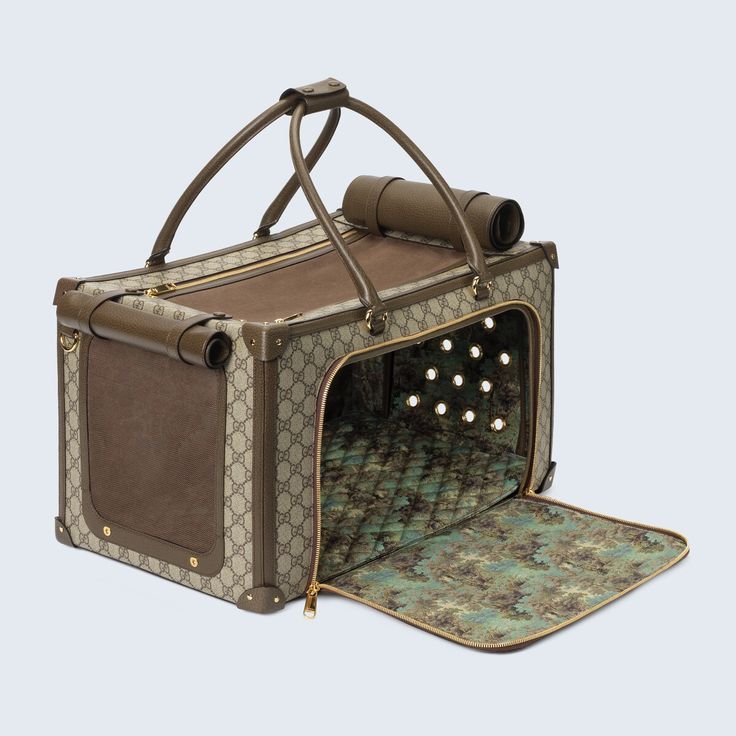 an open guccini suitcase with lights on the front and side panels, sitting on a rug