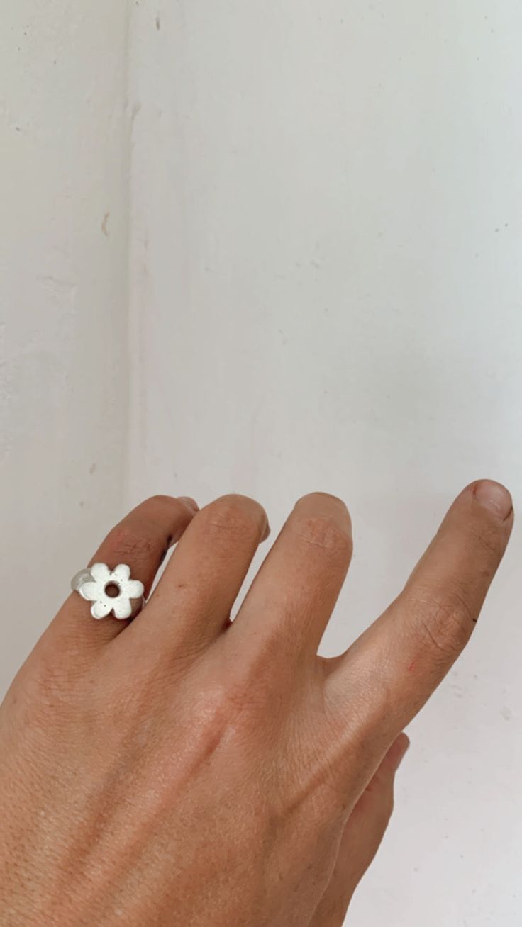 The daisy signet ring is a silver little daisy in a chunky signet design ✿ Hand carved & cast using the ancient lost wax technique, each piece is organic and solid, featuring the odd shadow of a fingerprint or slip of the carving tool.  Please bear in mind that every piece is made to order, please allow up to three Wax Ring Design, Carved Sterling Silver Signet Ring, Handmade Silver Signet Ring As Gift, Chunky Silver Ring, Lost Wax Rings, Daisy Signet Ring, Silver Handmade Collectible Signet Ring, Lost Wax Ring, Wax Carved Ring Signet