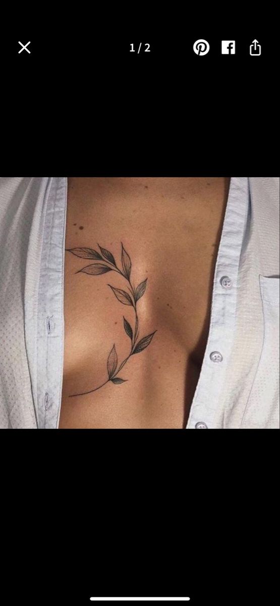 a woman's chest with leaves on it