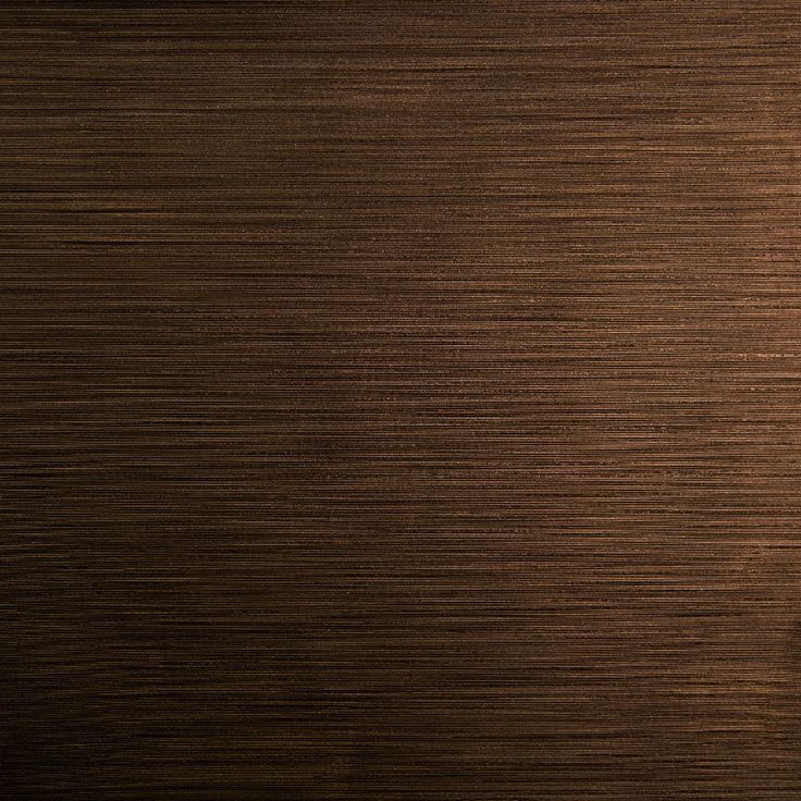 a close up view of a wood grain textured surface with the light shining on it