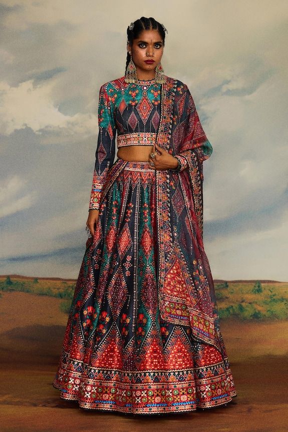 Multi color blouse with tribal print and threads, beads embroidery. Paired with coordinating lehenga and dupatta. - Aza Fashions Rajdeep Ranawat, Print Lehenga, Lehenga Pattern, Tunic Designs, Multi Color Blouse, Designer Jumpsuits, Sharara Set, Skirt Co Ord, Indian Attire