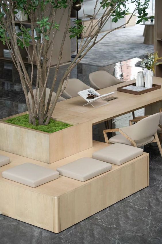 a table that has some chairs around it and a planter on top of it