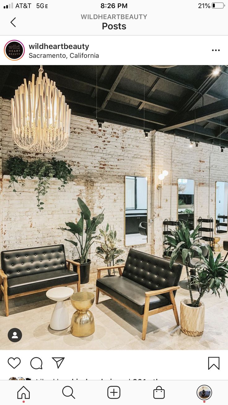 a living room filled with furniture and a chandelier