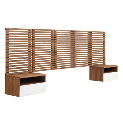 a wooden bench sitting next to a wall with slatted panels on it's sides