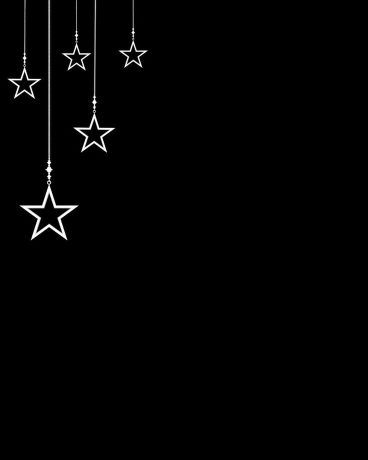 a black background with white stars hanging from it's sides and the bottom one is dark