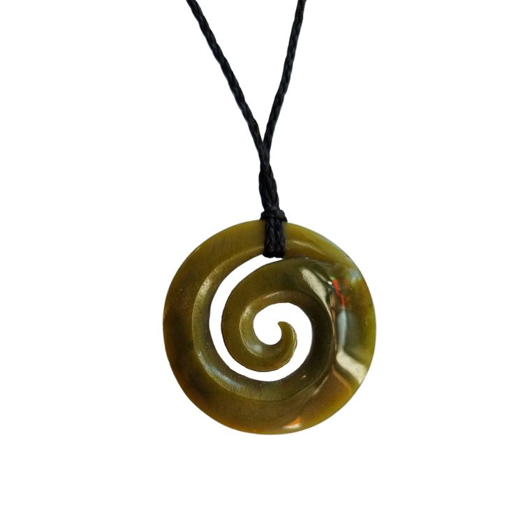 We offer FREE WORLDWIDE SHIPPING and dispatch all orders within 1-2 business days. Our Greenstone Koru Necklace is crafted from a green New Zealand Jade stone with hues of yellow. The carving is symbolic of nature and represents the unfurling frond of the fern - symbolic of hope, growth and new beginnings. Stone: Our Greenstone Koru Necklace is made from 100% Authentic Natural New Zealand Jade. Size: The Greenstone Koru Necklace is available in the below sizes and comes hung on a one size fits a Symbolic Green Round Pendant Jewelry, Green Adjustable Amulet Necklace, Adjustable Green Amulet Necklace, Unique Green Carved Necklace, Adjustable Green Amulet Style Necklace, Green Carved Amulet Necklace, Adjustable Green Carved Necklace, Adjustable Green Carved Necklaces, Green Symbolic Pendant Necklace