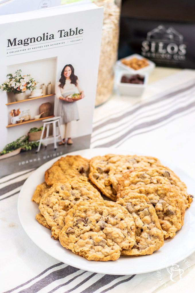 cookies on a plate next to a cookbook