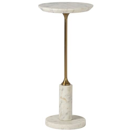 a white marble and brass pedestal with a gold metal stand on the top, it is isolated against a white background