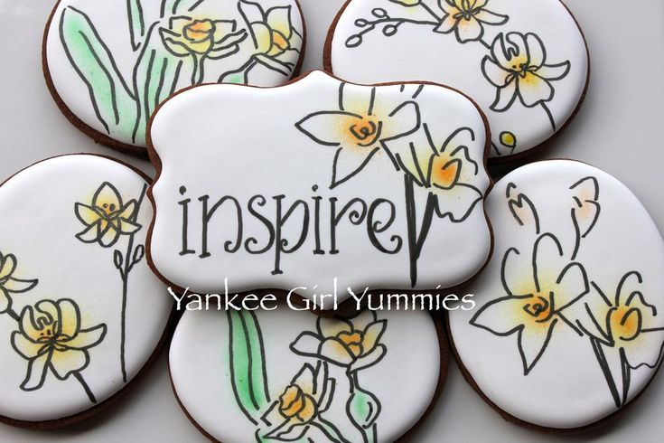 decorated cookies with the words inspire and daffodils