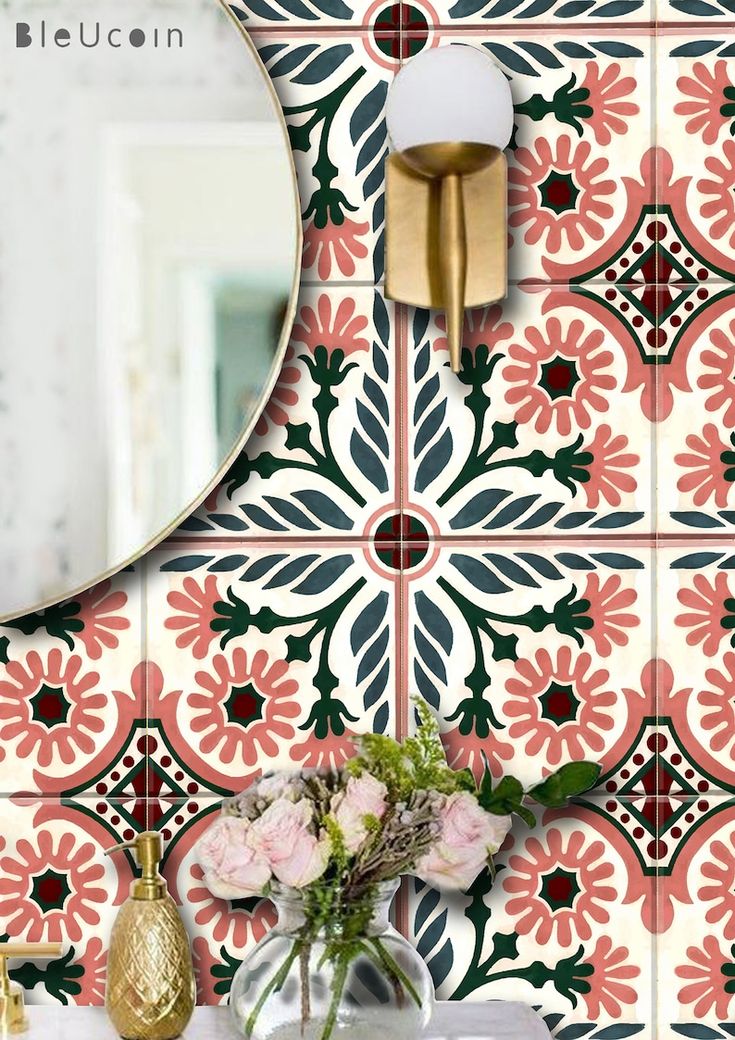 a vase with flowers sitting on top of a table next to a wall mounted mirror