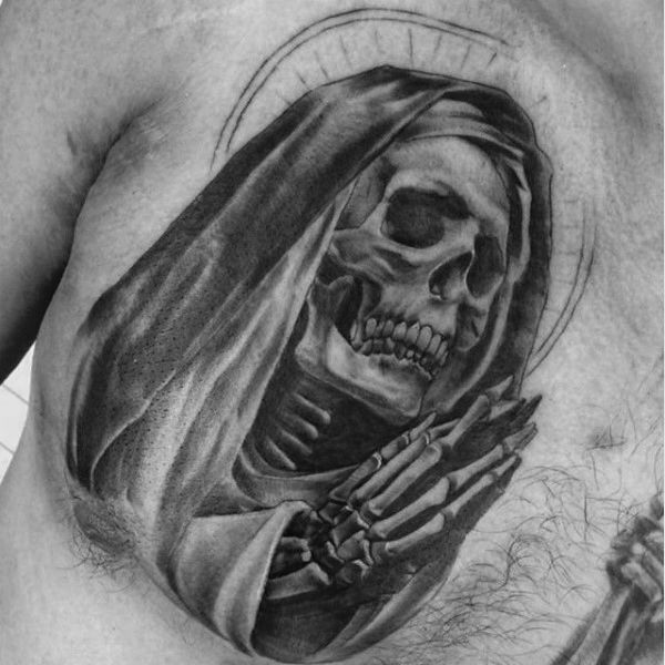 a man's chest with a skeleton and a cross on it, in black and white