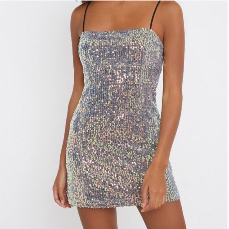 Shimmer And Shine In This Allover Sequin Dress From Uo. Features Fitted Silhouette With A Straight Neckline And Topped With Adjustable Shoulder Straps. Finished With A Mini Length Hem.; 66% Polyester, 34% Metallic Fibres; Machine Wash; Size Xl Does Not Have Tag Attached Metallic Sequin Summer Party Dress, Summer Party Metallic Sequin Dress, Sparkling Metallic Mini Dress For Party Season, Sparkling Mini Dress For Summer Party, Metallic Summer Party Dress, Summer Party Sparkling Mini Dress, Sparkling Summer Party Mini Dress, Metallic Sequin Disco Dress For Summer, Metallic Fitted Sequin Dress For Spring