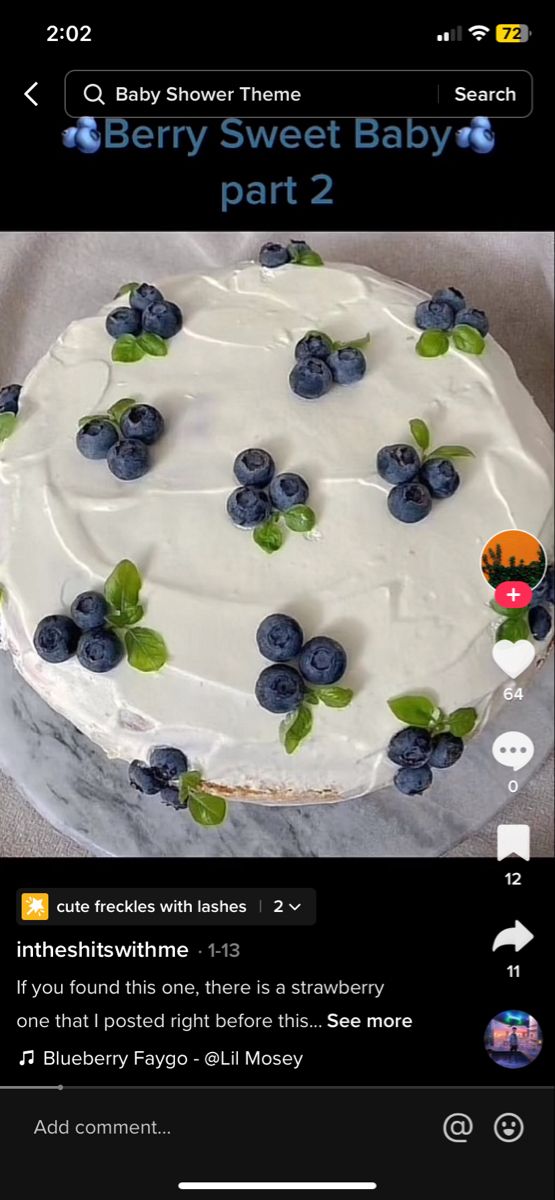 a cake with white frosting and blueberries on top is shown in the app