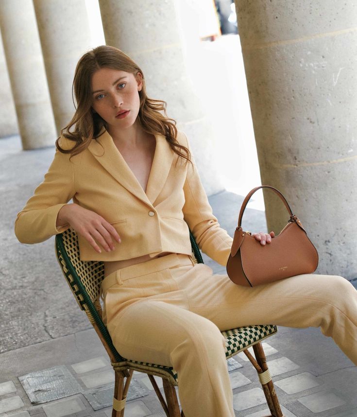 Whether it's summer or winter, our caramel-colored Mini Pivoine handbag enriches your outfits with a golden note, bringing elegant warmth to your look.
Each bag is meticulously handcrafted in our Italian workshop, using superior grained calf leather complemented by careful golden details. Offering versatile carrying options, it can be worn by hand, on the shoulder, or crossbody thanks to its additional strap. The easy opening is ensured by a robust zipper that reveals a spacious and elegant bei Chic Caramel Shoulder Bag, Caramel Bag Outfit, Elegant Caramel Shoulder Bag, Luxury Spring Shoulder Bag For Workwear, Elegant Shoulder Bag For Work In Spring, Elegant Shoulder Bag For Workwear In Spring, Elegant Shoulder Bag For Work And Spring, Elegant Shoulder Bag For Spring Workwear, Elegant Spring Shoulder Bag For Work