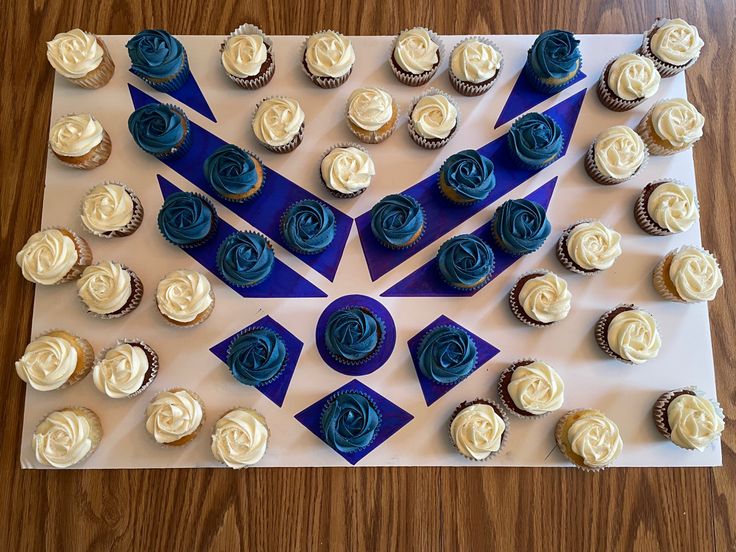 cupcakes are arranged in the shape of an arrow