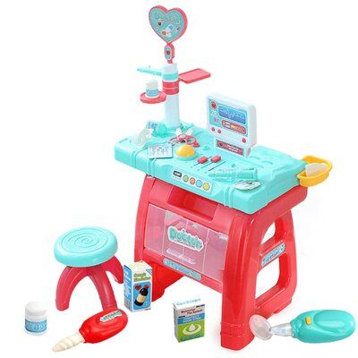 a toy kitchen playset with accessories including a stove, sink and potty pan