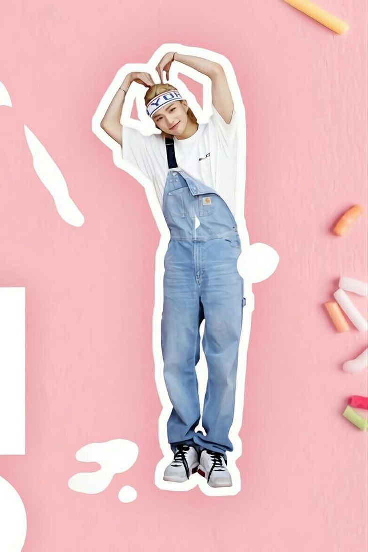 a man in overalls standing on top of a pink background with pencils and crayons