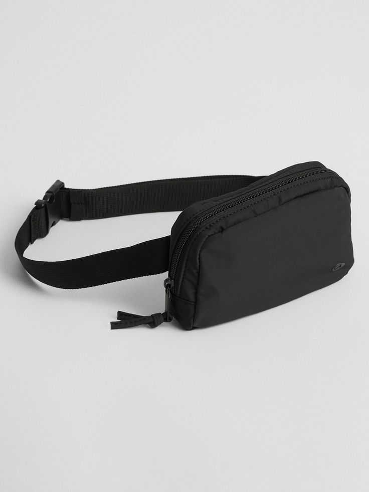 GapFit 100% Recycled Fanny Pack | Gap Factory Daily Use Recycled Polyester Bag With Adjustable Strap, Recyclable Nylon Bags For Daily Use, Black Reusable Nylon Bag, Versatile Bags For Daily Use Made Of Recycled Polyester, Casual Reusable Nylon Bag, Casual Nylon Travel Accessories With Removable Pouch, Black Recycled Polyester Bags For Everyday, Casual Black Bag In Recycled Polyester, Casual Nylon Travel Accessories With Adjustable Strap