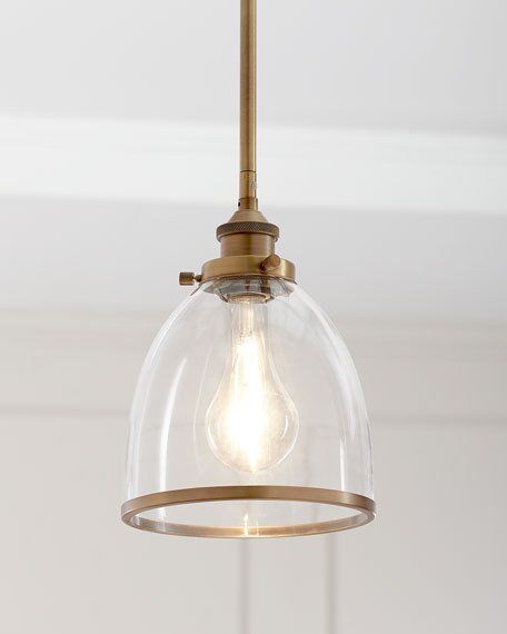 a light that is hanging from the ceiling with a clear glass dome on it's side