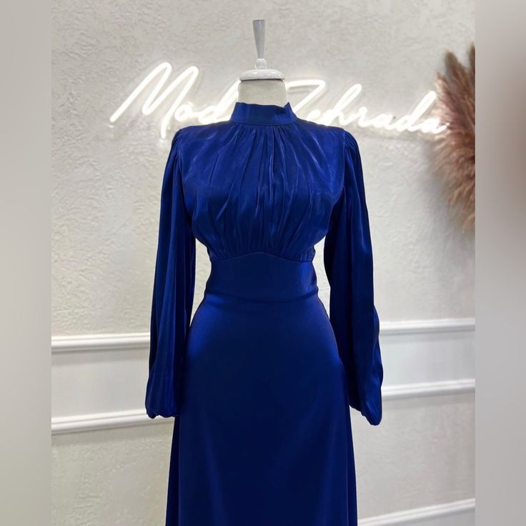 This Is A Very Nice And Unique Dress. It Is Made Of A Somewhat Satin Material. Brand New And Never Before Worn, And In Great Condition. Royal Blue Long Sleeve Formal Dress, Elegant Royal Blue Midi Dress, Elegant Royal Blue Dress For Night Out, Elegant Royal Blue Evening Dress For Night Out, Elegant Blue Maxi Dress For Dinner, Blue Long Sleeve Evening Dress For Dinner, Royal Blue Long Sleeve Evening Midi Dress, Elegant Royal Blue Long Sleeve Dress, Blue Fitted Maxi Dress For Dinner