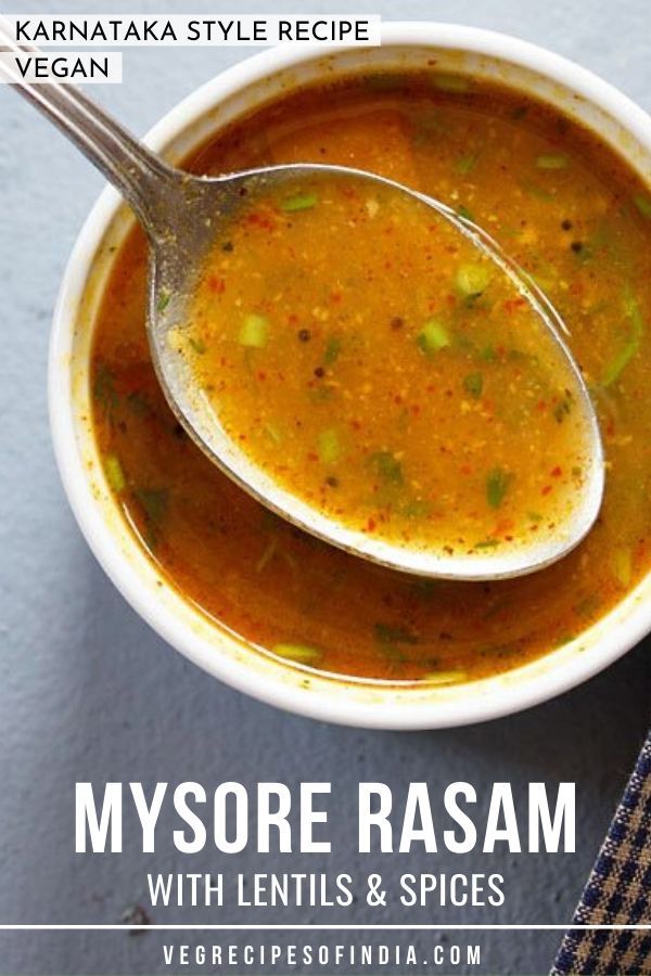 a spoon full of soup on top of a white bowl with the words, mysore rasam with lentils and spices