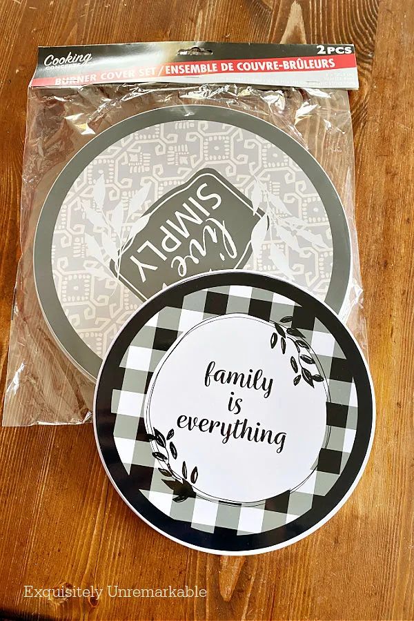 two plates with the words family is everything in black and white on them, sitting on a wooden table