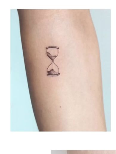 a tattoo on the arm that has an hourglass in it and sand running through it