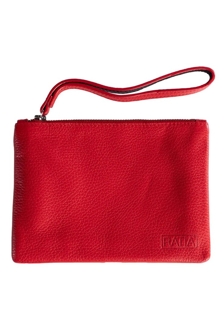 a red leather purse with a long strap