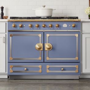 a blue and gold stove top oven in a kitchen