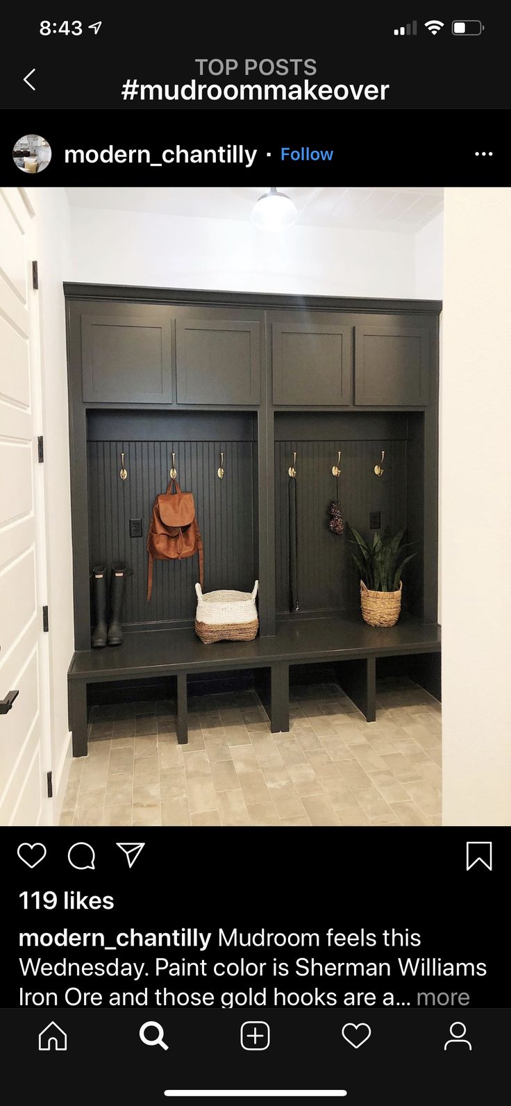 an instagramted photo of a mudroom with two benches and a bench in the middle