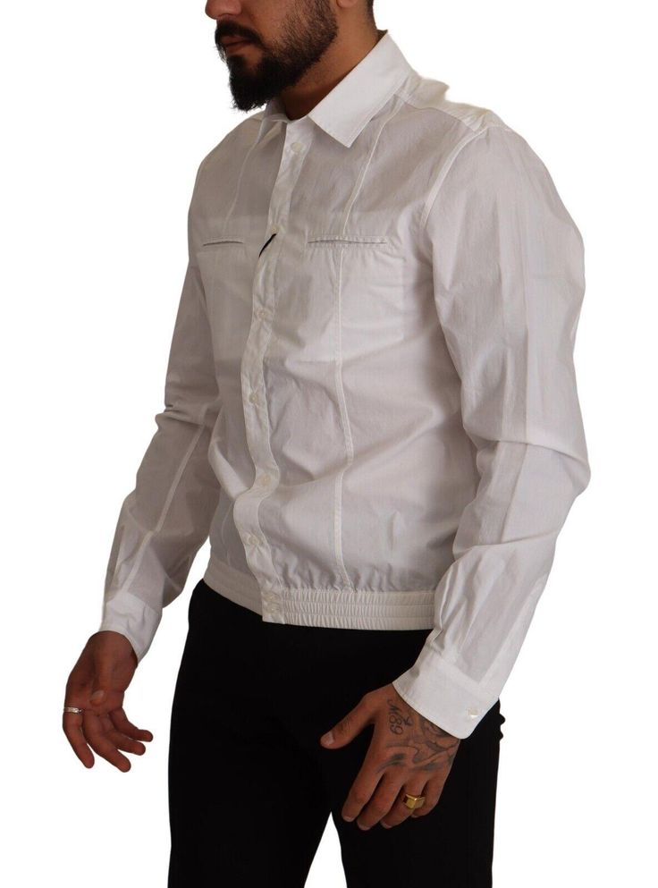 Authentic Dolce & Gabbana collared casual shirt Brand new with tags Made from 100% cotton Full button closure Logo details Classic white color Expertly crafted in Italy Material: 100% Cotton Designer White Shirt With Button Cuffs, Designer Long Sleeve Shirt With Pockets, Designer Long Sleeve Cotton Shirt, White Cotton Shirt With Fold-down Collar, White Cotton Shirt With Fold Down Collar, Designer Long Sleeve Shirt With Placket, Designer White Tops With Button Cuffs, Formal Cotton Tops With Pockets, Designer Long Sleeve Tops With Pockets