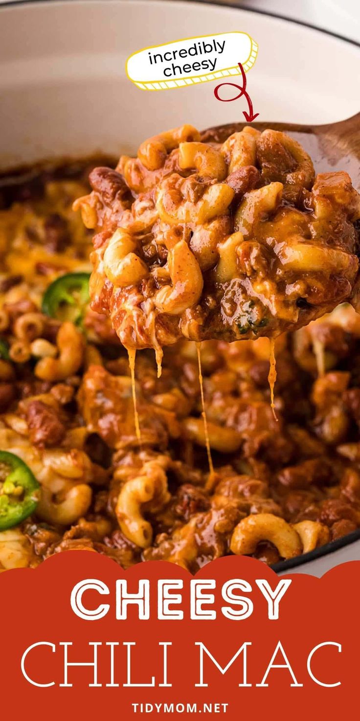 the cheesy chili mac is being lifted with a spoon